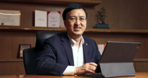 Liu Qu sits at his desk