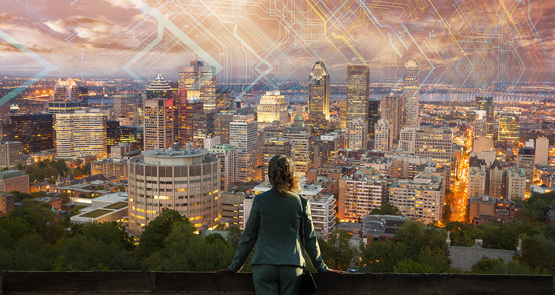 A Canadian woman actuary looks out over the Montreal skyline.
