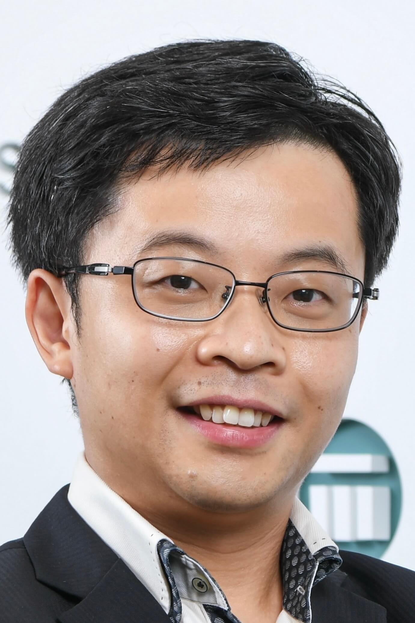 Headshot of a smiling Jacky Ng