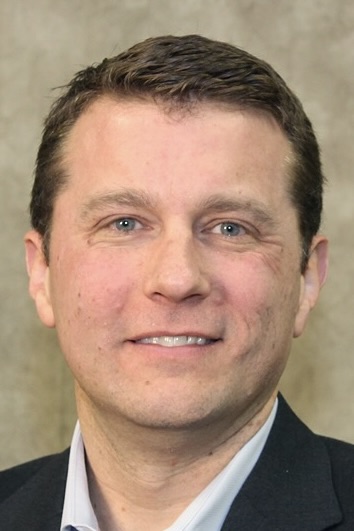 Headshot of a smiling Toby Hall