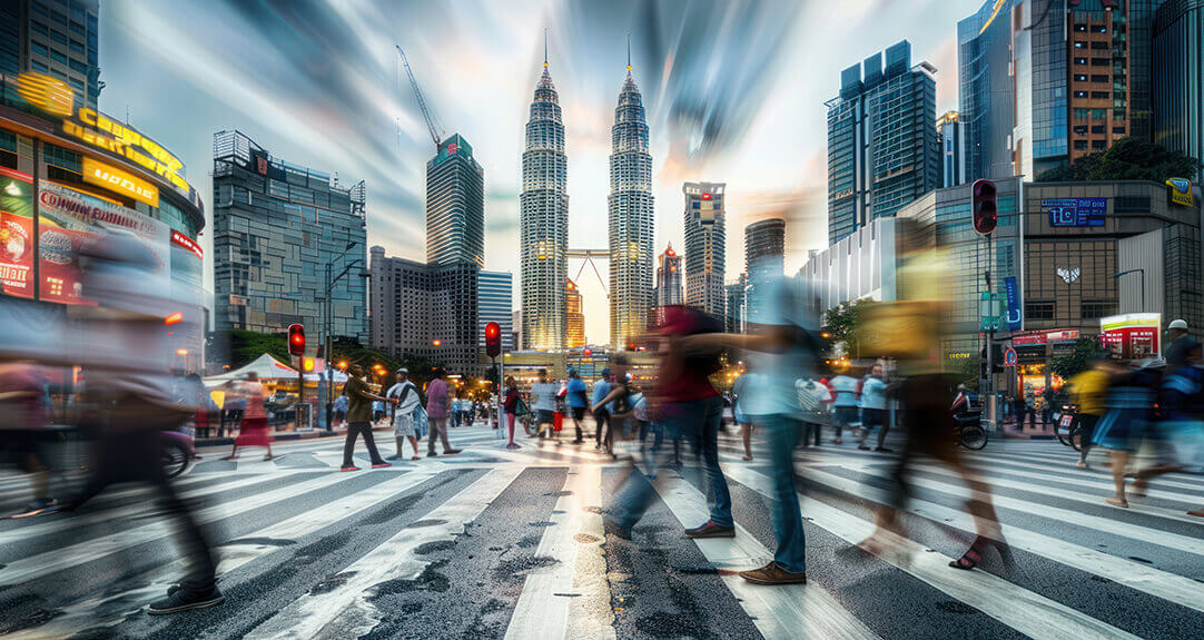 Blurred Pedestrians Crossing Street in Kuala Lumpur, Malaysia