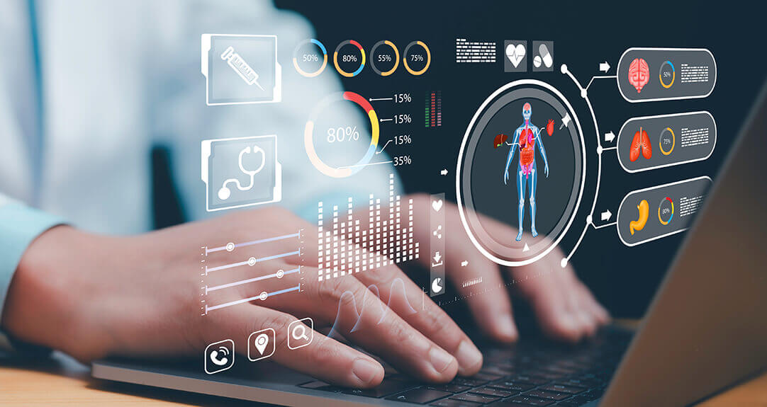 Hands rest lightly over a laptop keyboard as floating graphics show generalized health data.